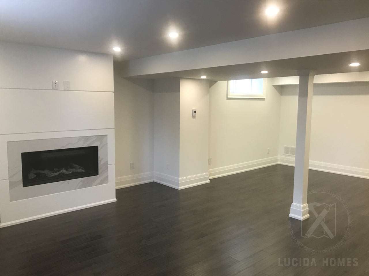 basement finishing Lucida homes fireplace